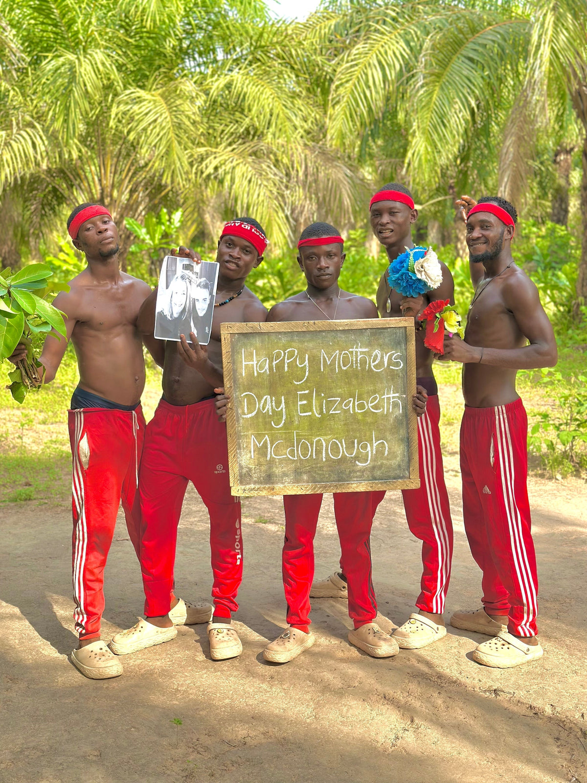 Group of performers holding a personalised birthday greeting sign – custom video greetings by Wishes Made Easy