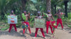 African performers in red traditional outfits recording a personalised video greeting